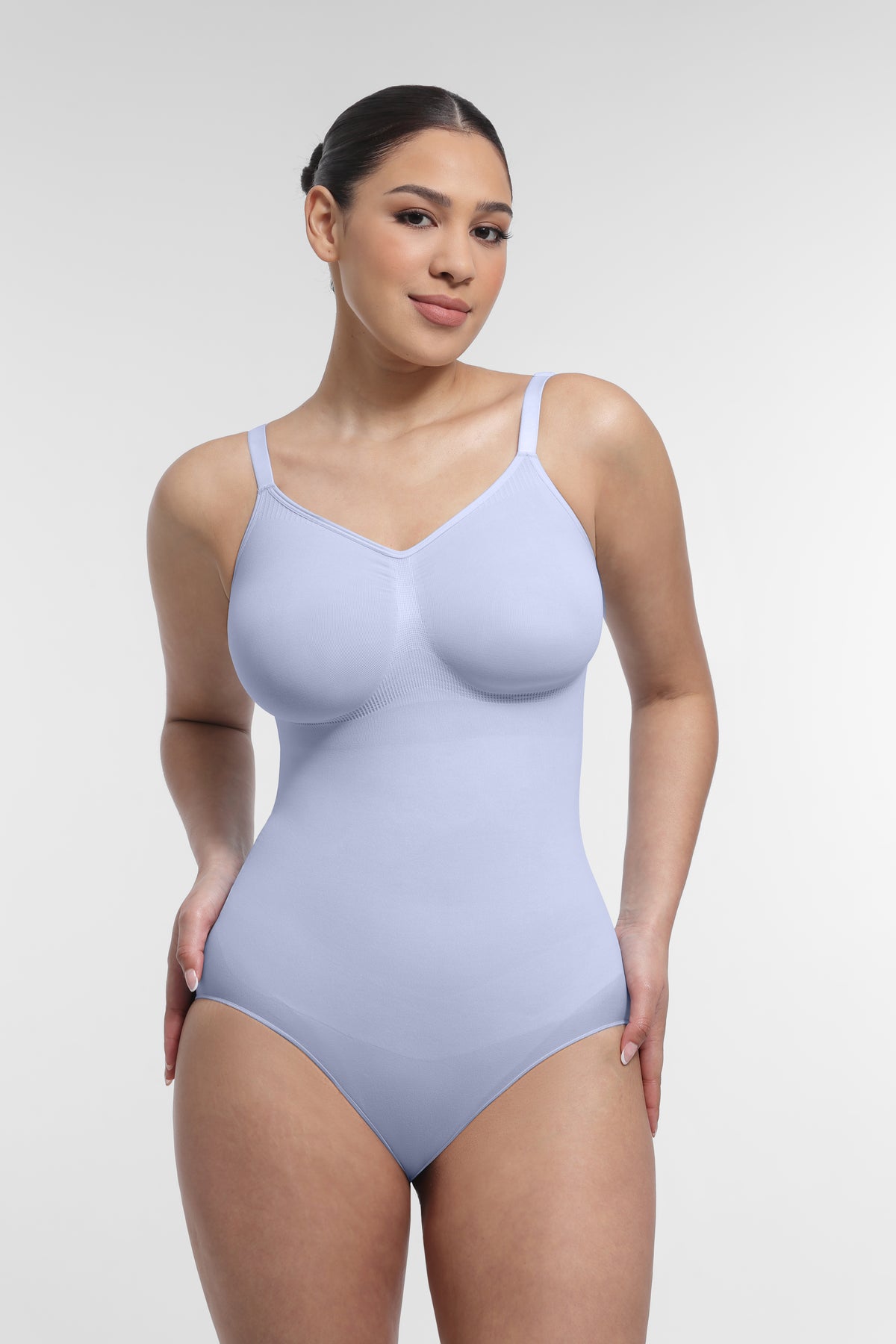 Shop Lily SculptEase Shaping Bodysuit in light blue, seamless shaping bodysuit with adjustable straps – front view