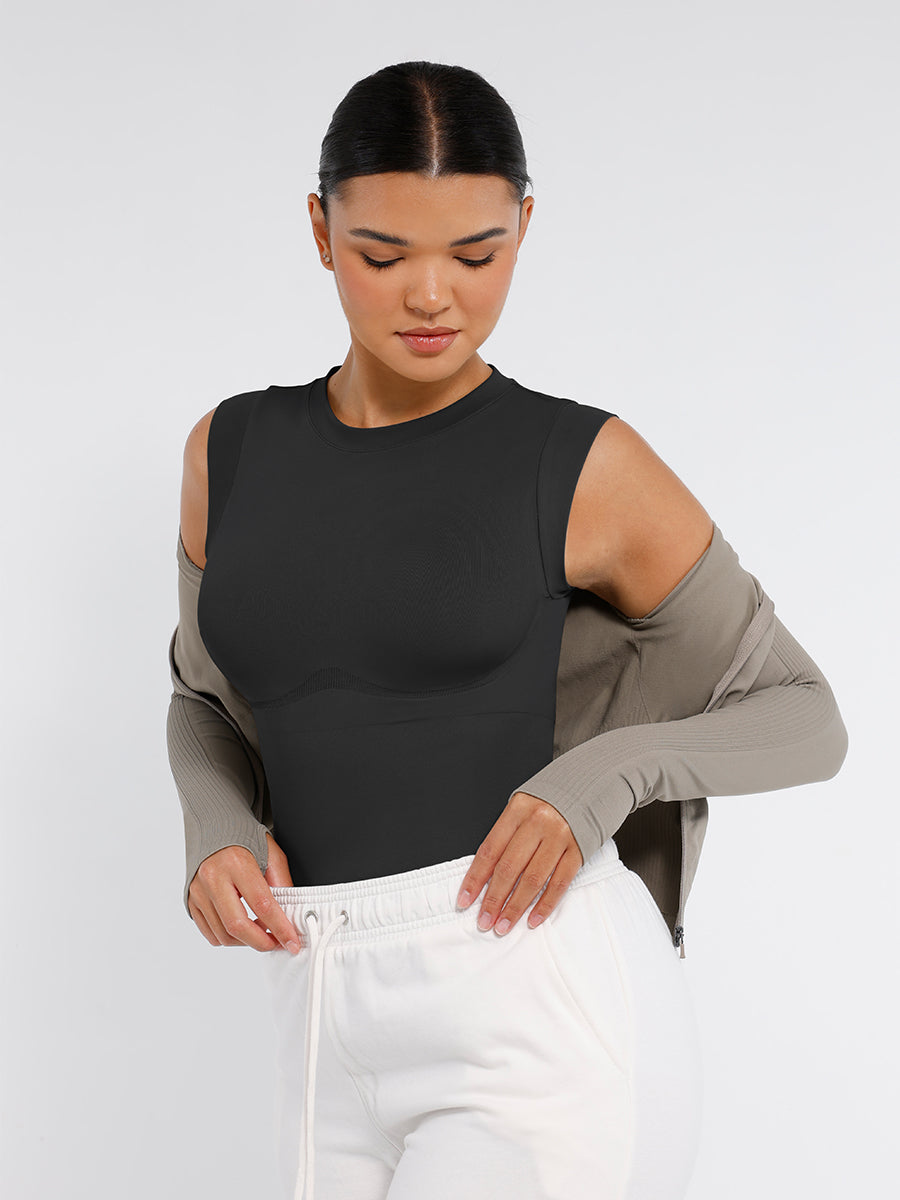 Sculpt Chic High-Neck Bodysuit in black – styled with a grey cardigan and white trousers