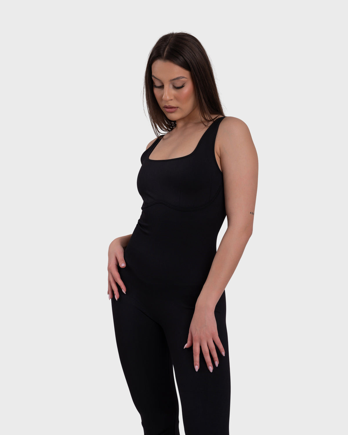 All Day Sculpting Flare Jumpsuit in black – full-length three-quarter view