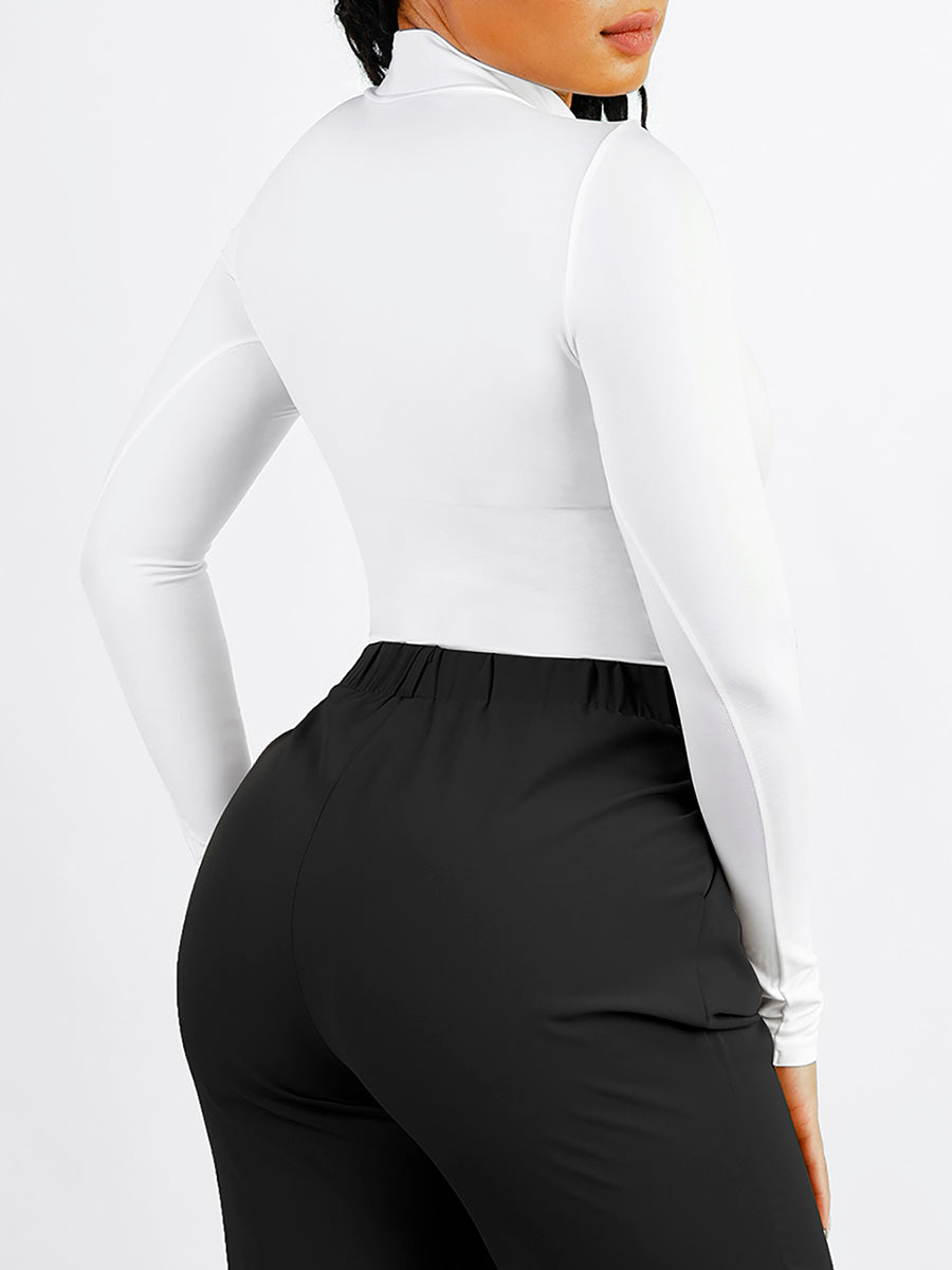 Long Sleeve Turtle Neck Bodysuit in white – tucked into black trousers