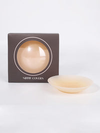 Shop Lily Invisible Nipple Covers in nude, reusable silicone nipple covers – shown with its round storage case