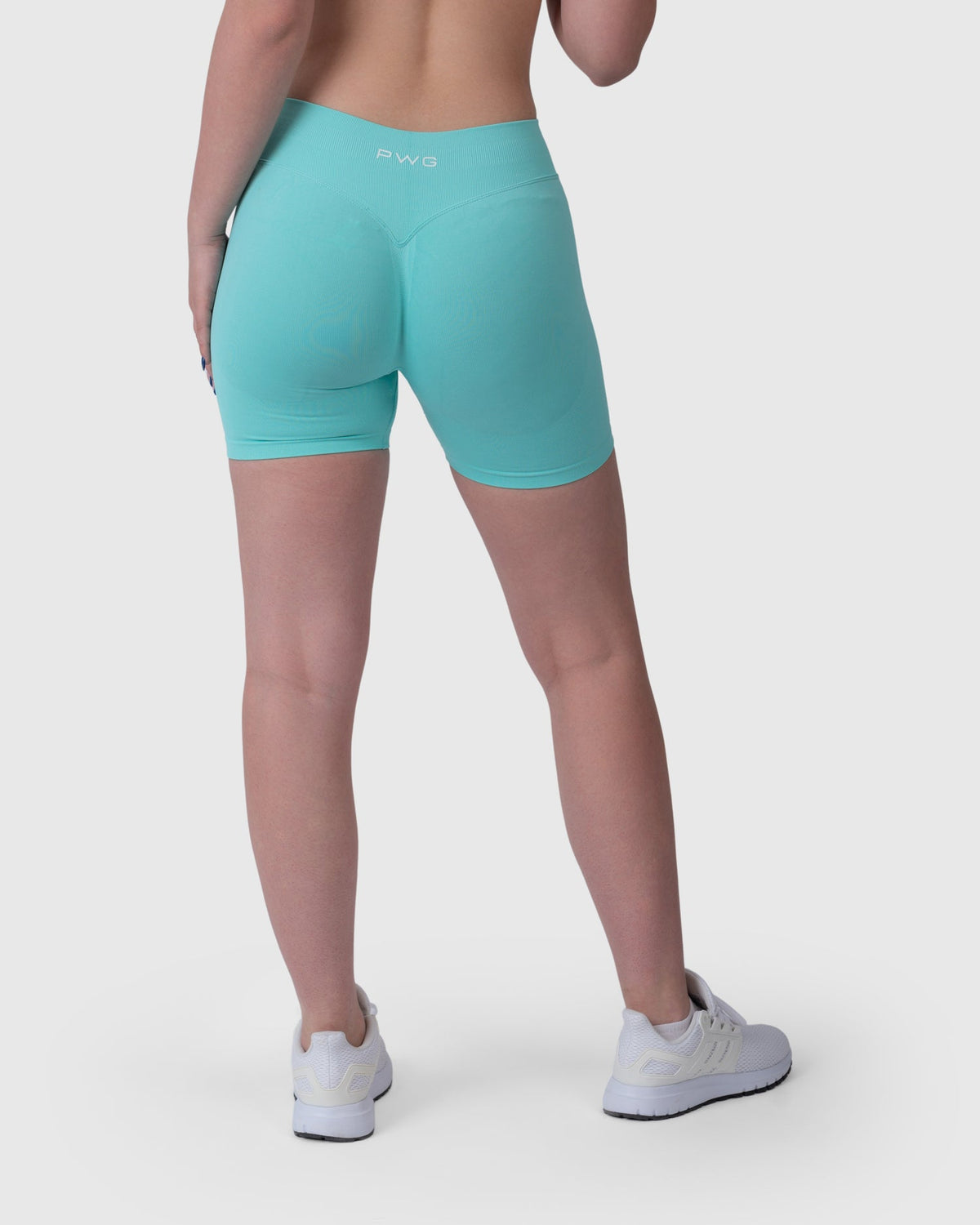 Form Sculpting Shorts in aqua – back three-quarter view