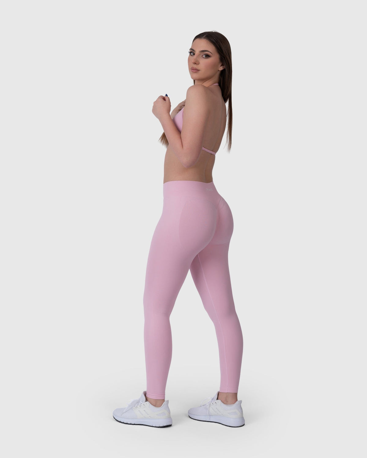 Form Sculpting Leggings in pink – full-length three-quarter view
