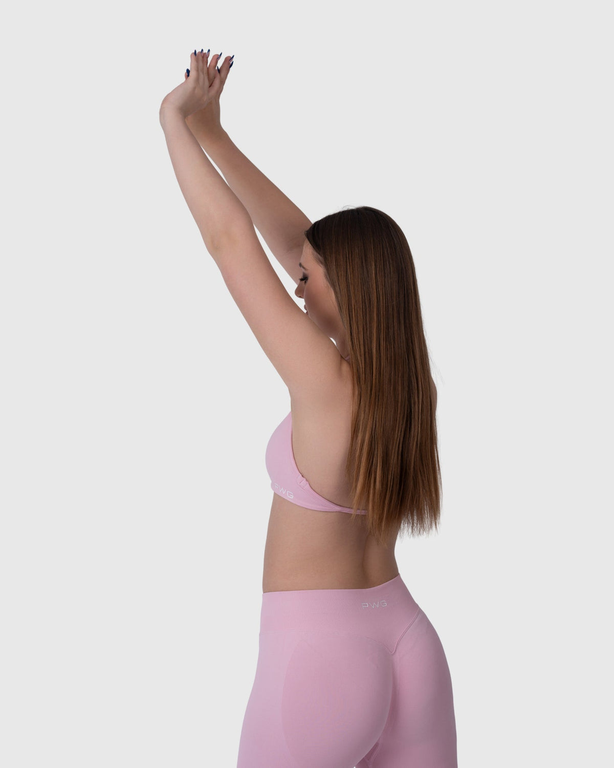 Form Backless Bra in pink – model posing with arms raised