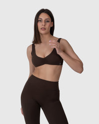 Shop Lily Align Soft Twist Sports Bra in espresso, twist-front sports bra – front view