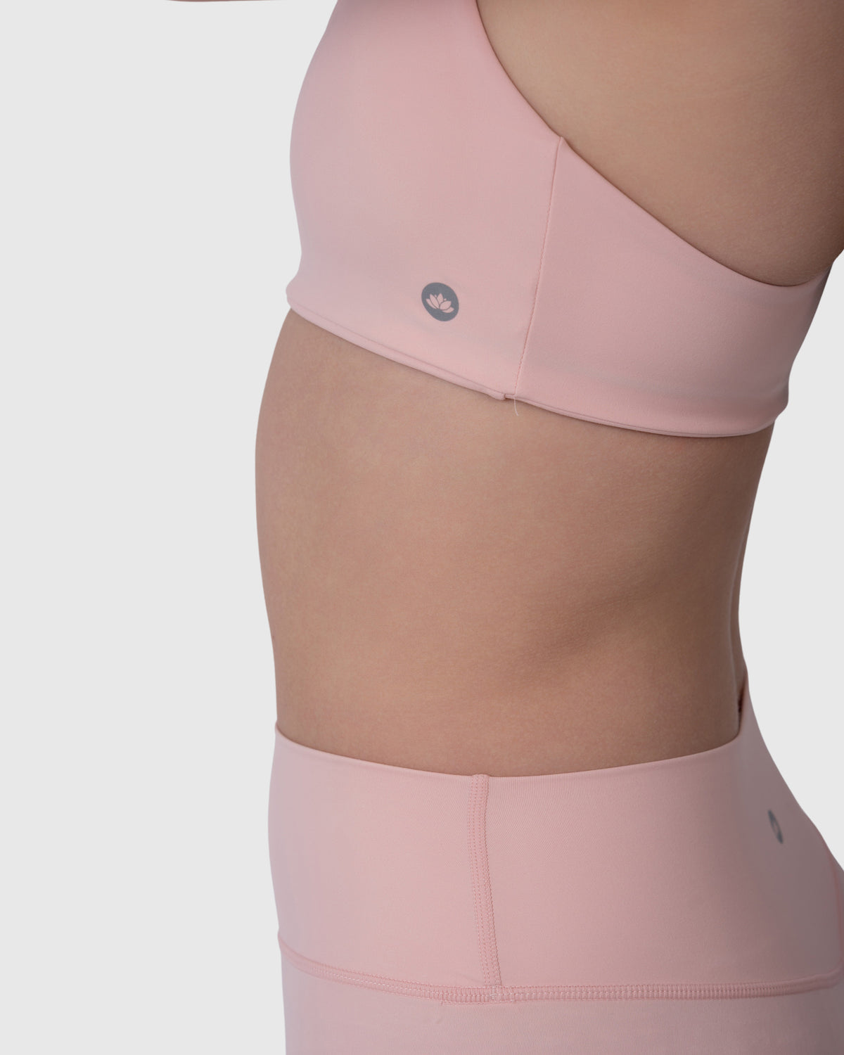 Align Sports Bra in rose – close-up of the side logo and band