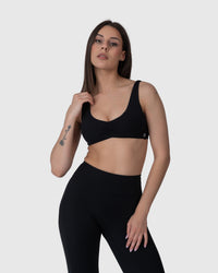 Shop Lily Align Soft Twist Sports Bra in black, twist-front sports bra – front view