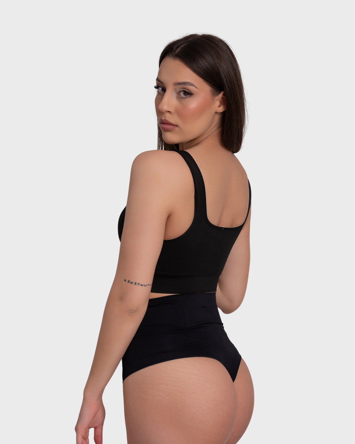Tummy Control Shaping Thong Panties in black – three-quarter view
