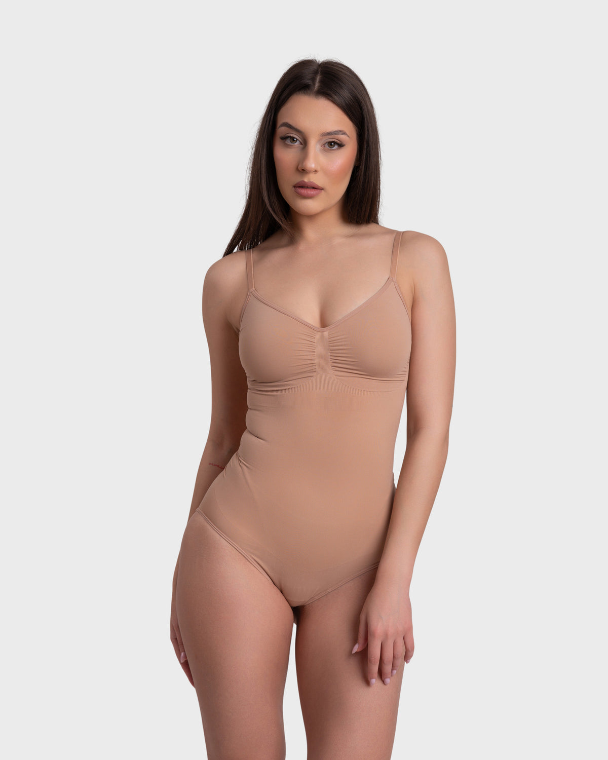 Shop Lily Ultimate Sculpt Bodysuit in nude, seamless tummy-control shaping bodysuit – front view
