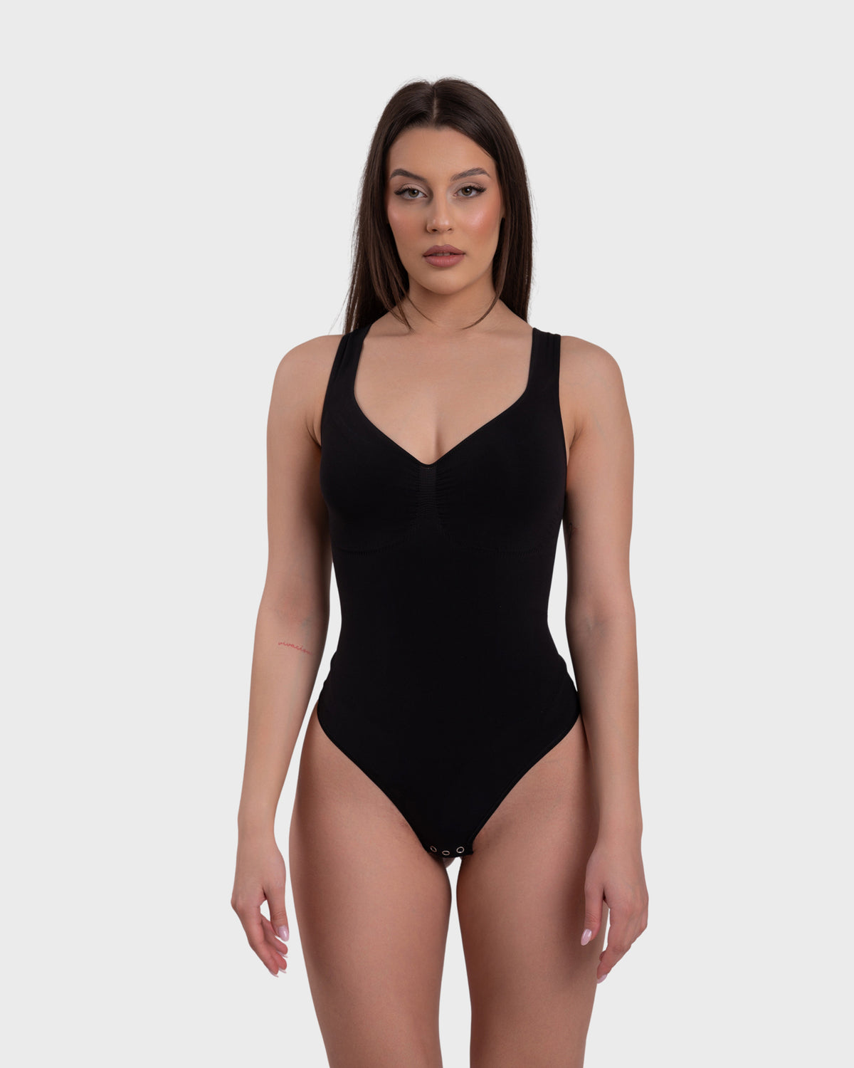 Shop Lily SculptCurve Thong Bodysuit in black, seamless scoop neck sculpting thong bodysuit – front view