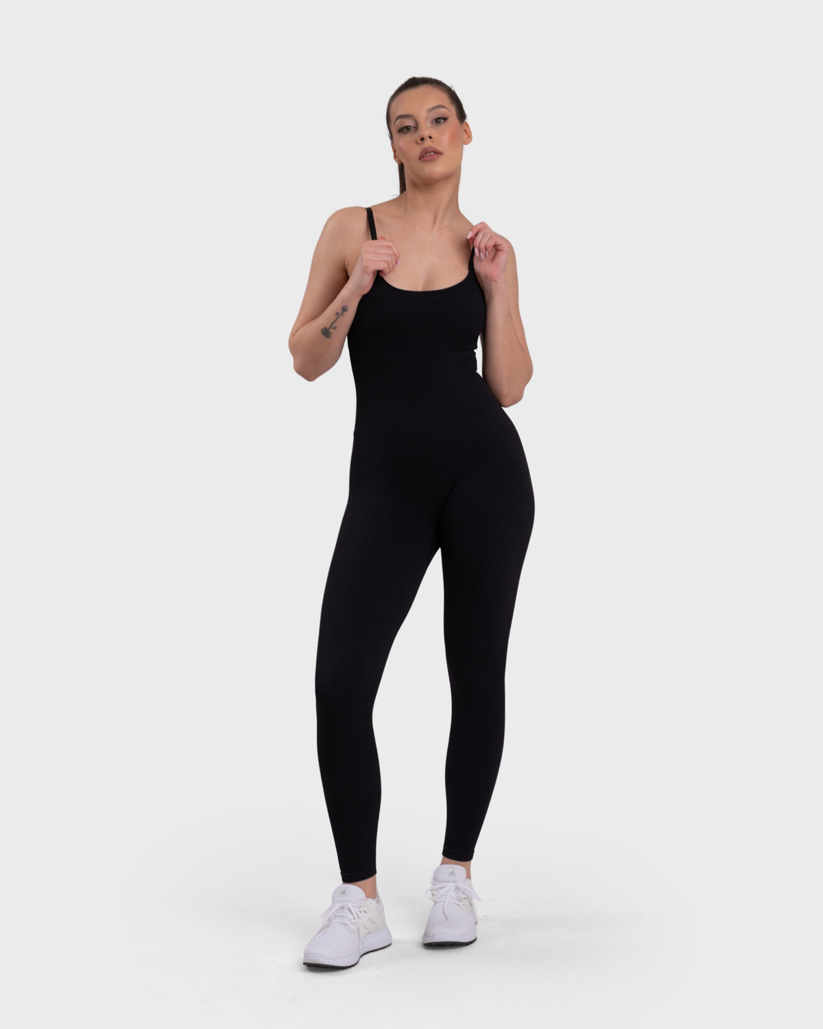 Shop Lily Ribbed Sculpting Jumpsuit in black, sleeveless ribbed sculpting jumpsuit – full-length front view