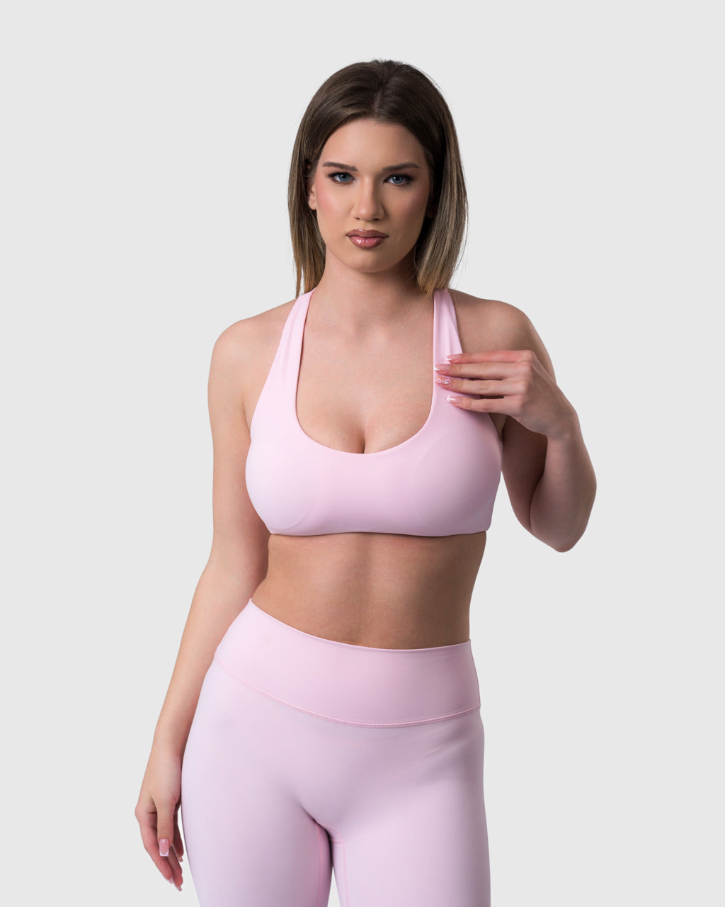 Shop Lily Core Sports Bra in baby pink, racerback sports bra – front view