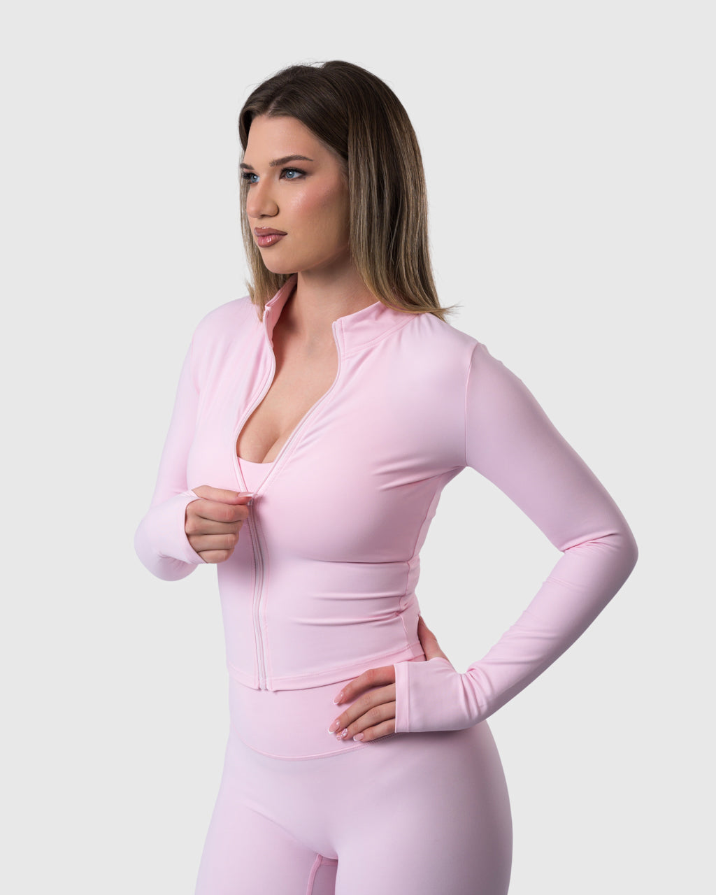 Shop Lily Core Jacket in baby pink, fitted zip-up activewear jacket – front view