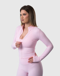Shop Lily Core Jacket in baby pink, fitted zip-up activewear jacket – front view