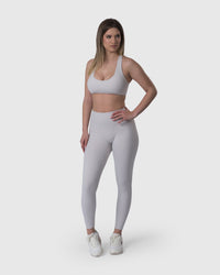 Shop Lily Core Sports Bra in ivory, racerback sports bra – full-length front view