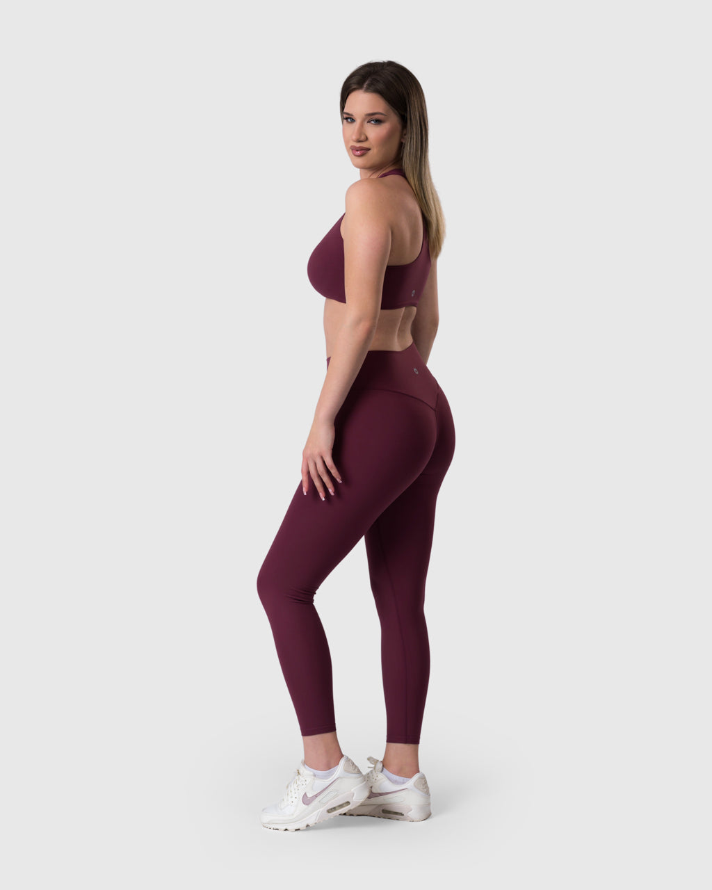 Core Leggings in burgundy – full-length three-quarter view