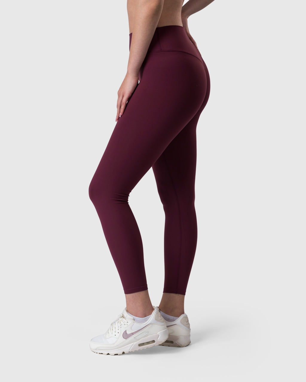 Core Leggings in burgundy – back three-quarter view