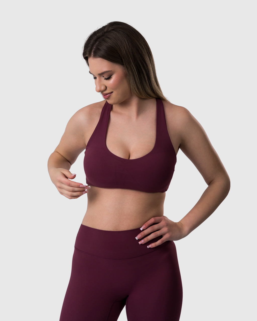 Shop Lily Core Sports Bra in burgundy, racerback sports bra – front view