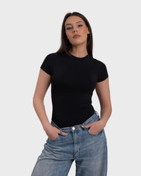 Shop Lily Short Sleeve Crew Neck Bodysuit in black, short sleeve crew neck bodysuit – styled with jeans