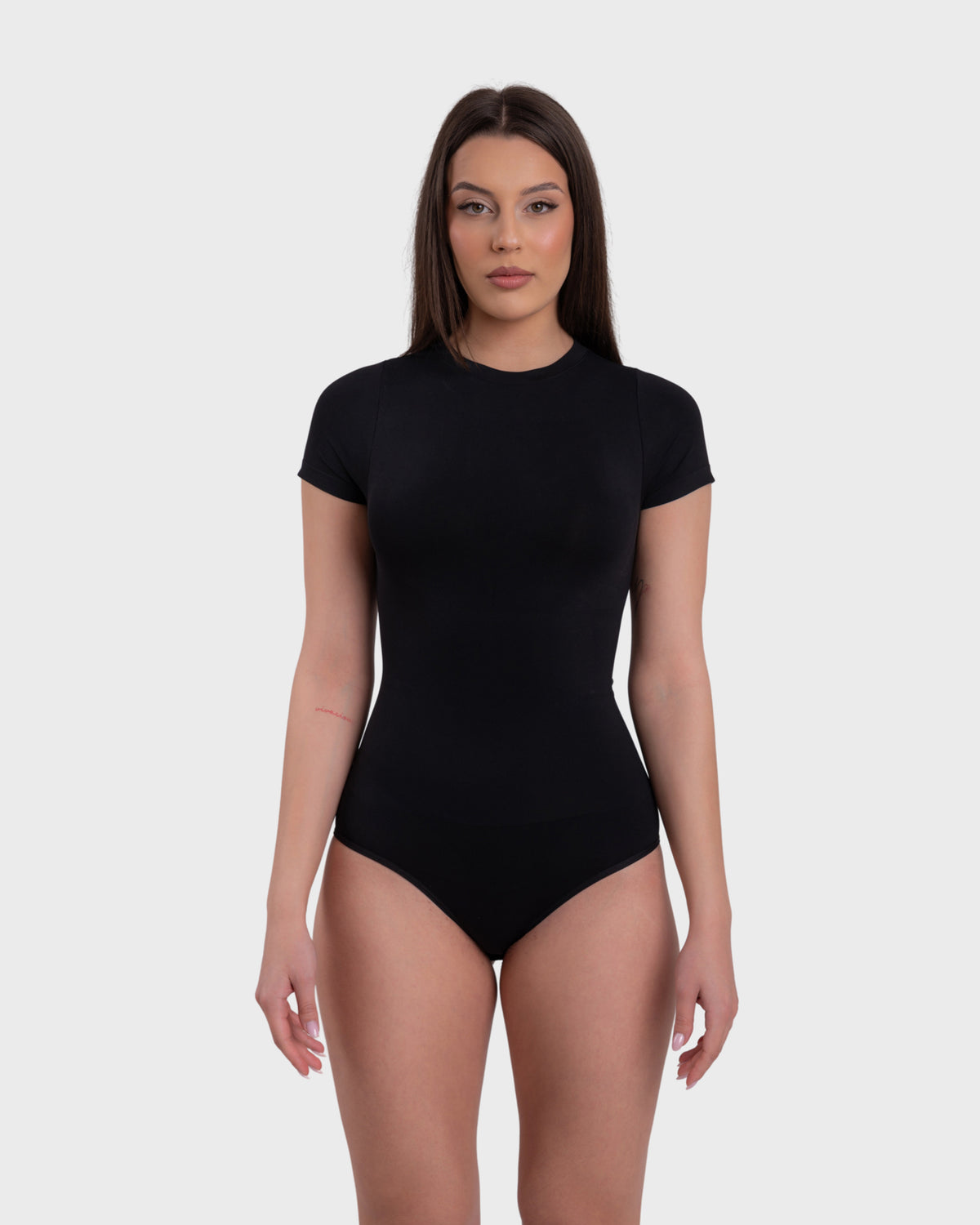Short Sleeve Crew Neck Bodysuit in black – front view