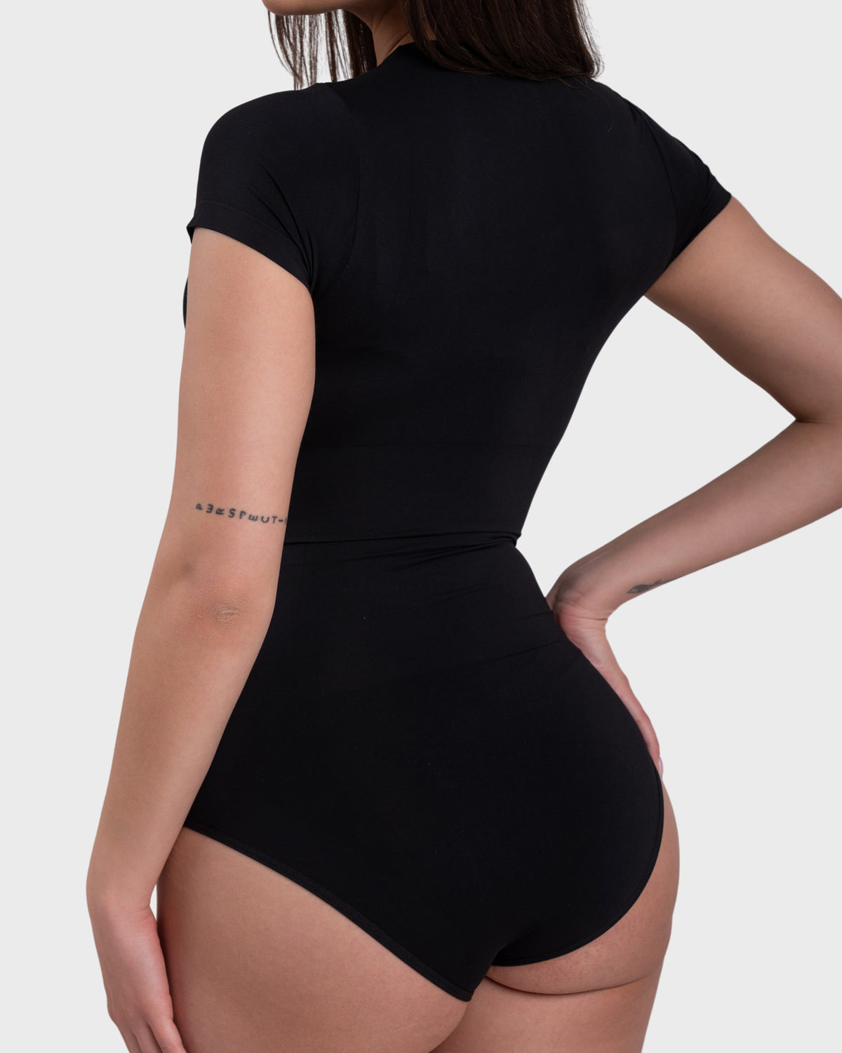 Short Sleeve Crew Neck Bodysuit in black – side view