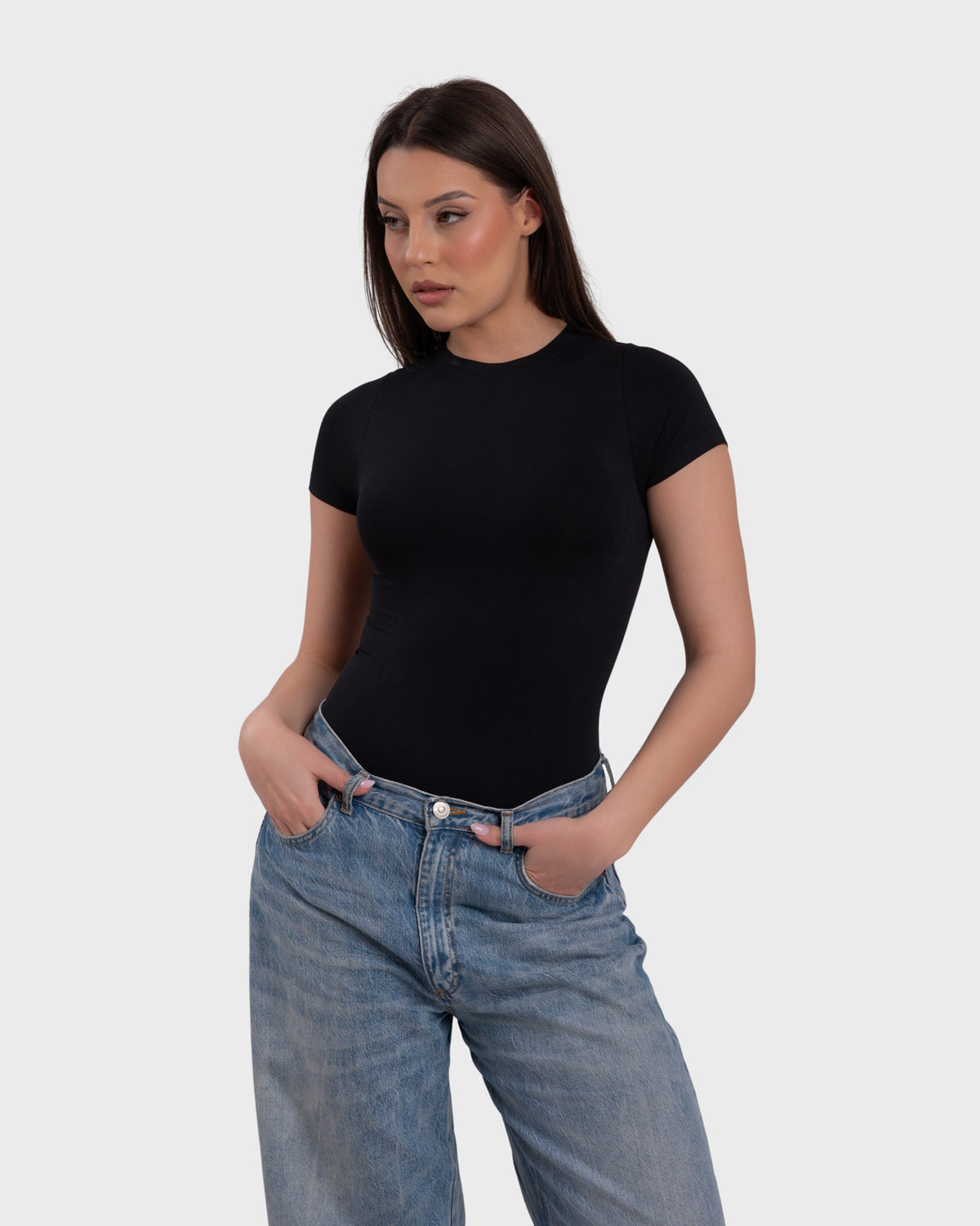 Short Sleeve Crew Neck Bodysuit in black – styled with jeans