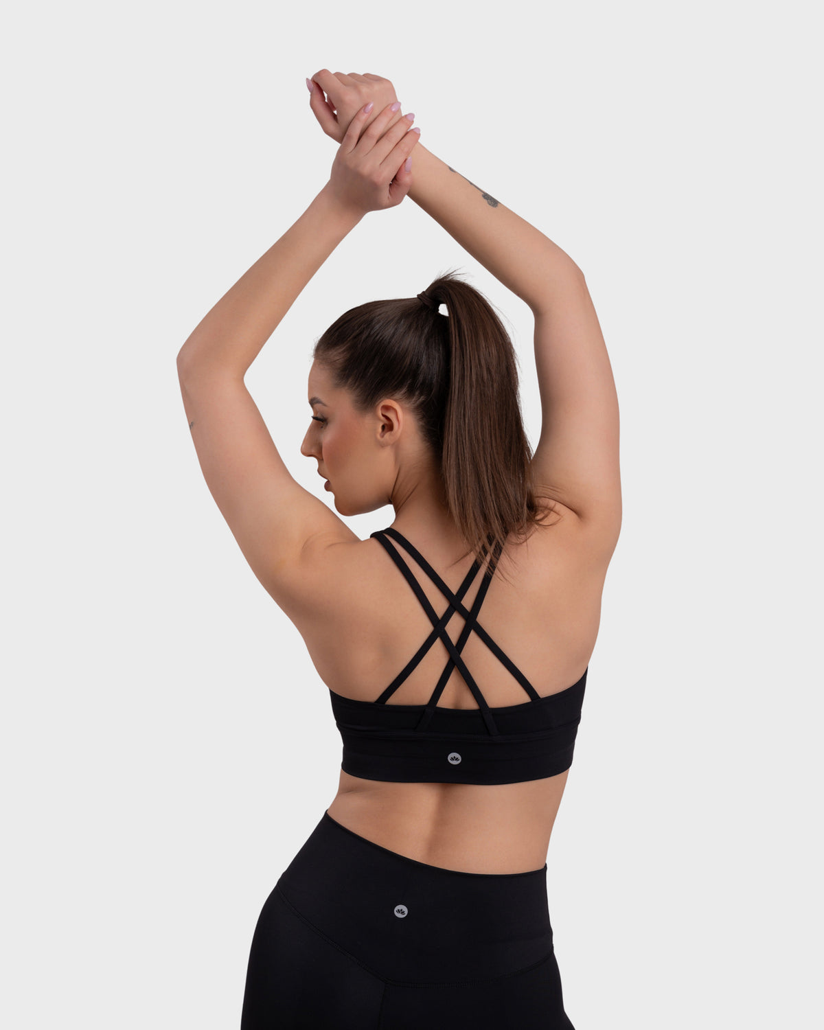 Evolve Active Sports Bra in black – close-up of the crisscross back straps